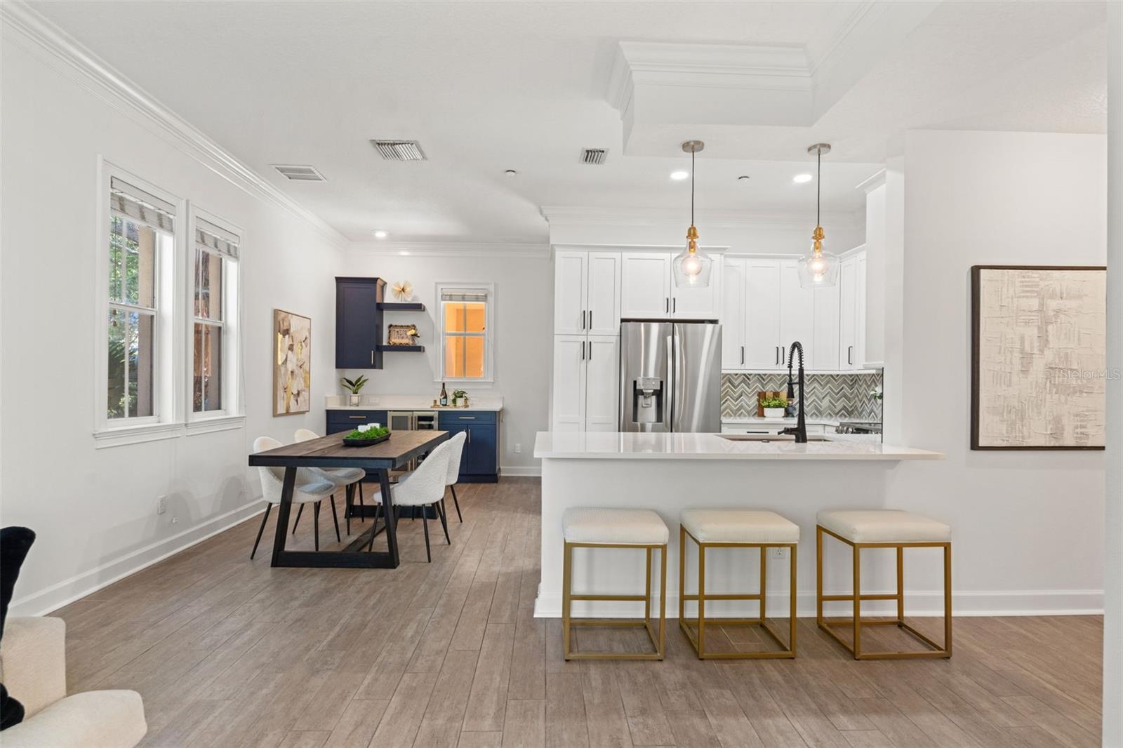 View of kitchen and dining space with built in bar
