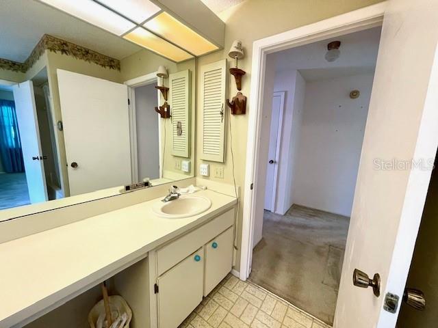 Primary bath includes a second door into the hallway outside the second bedroom.
