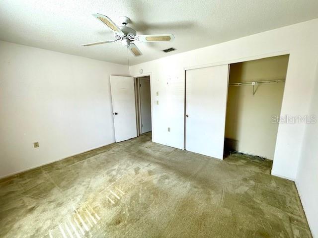 Guest bedroom with built-in closet.