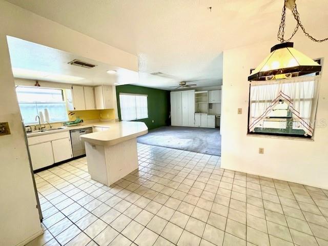 Large kitchen with breakfast bar and eat-in area.