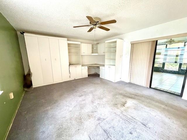 Family room with built-in cabinets and Murphy bed could be enclosed to make a third bedroom.