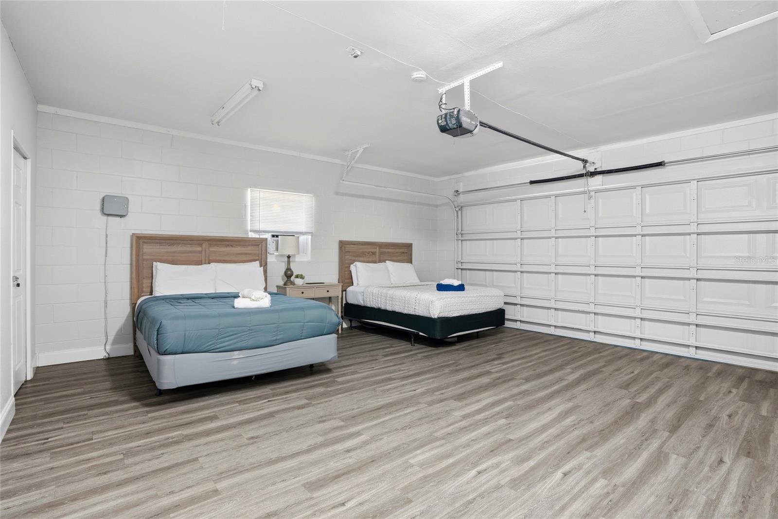 Garage w/ Window A/C, and flex space for bedrooms, can be converted back to car garage, Garage door works!