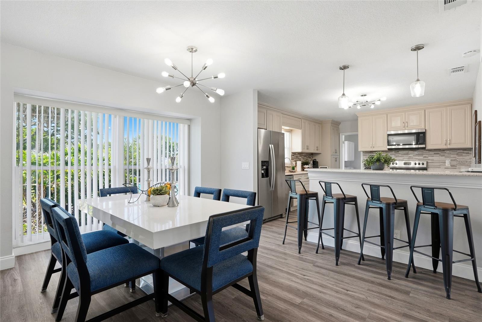 Dining Room overlooking backyard and Kitchen to the right