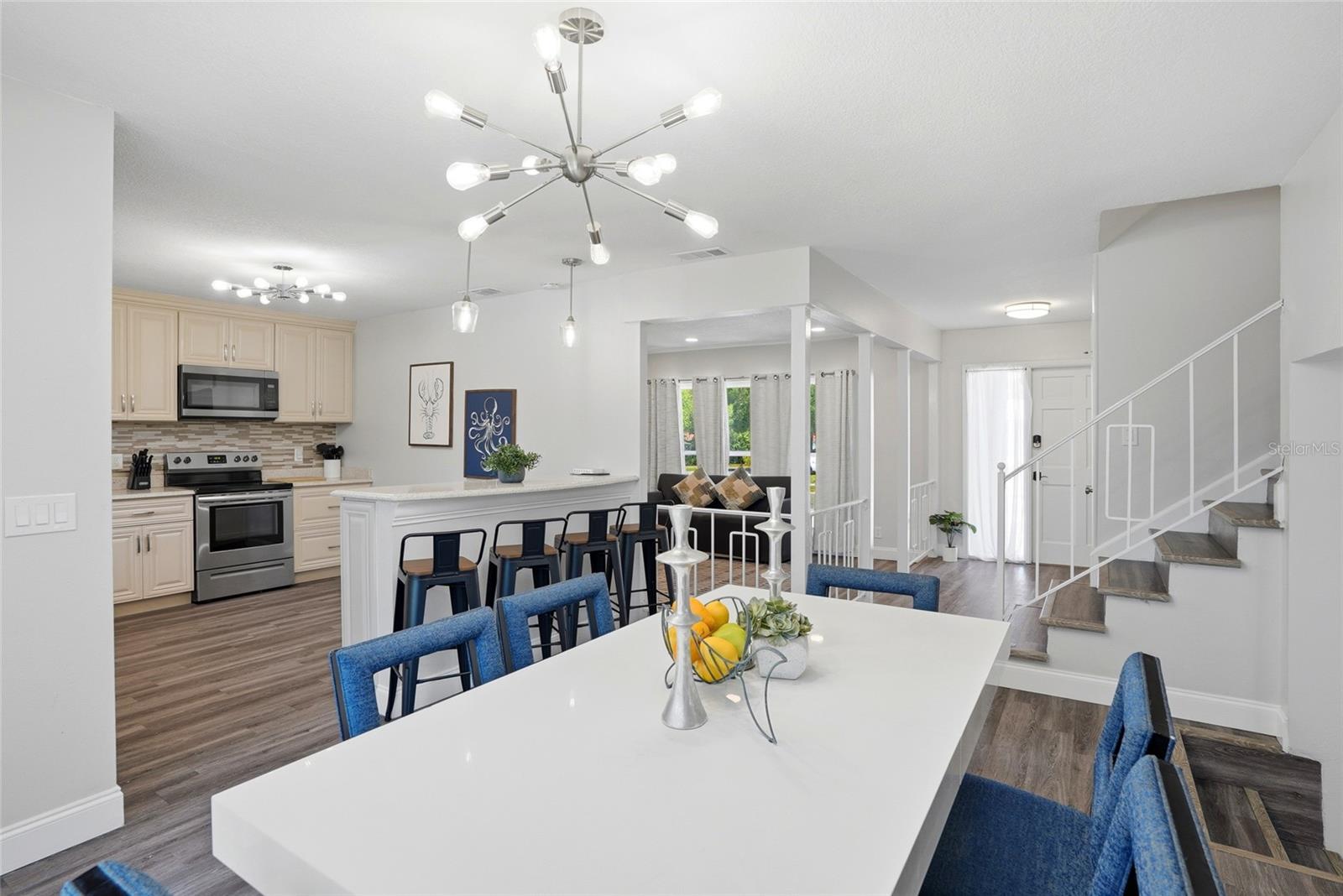Dining Room facing entrance, stairs leading to 2nd story bedrooms/baths and second living room