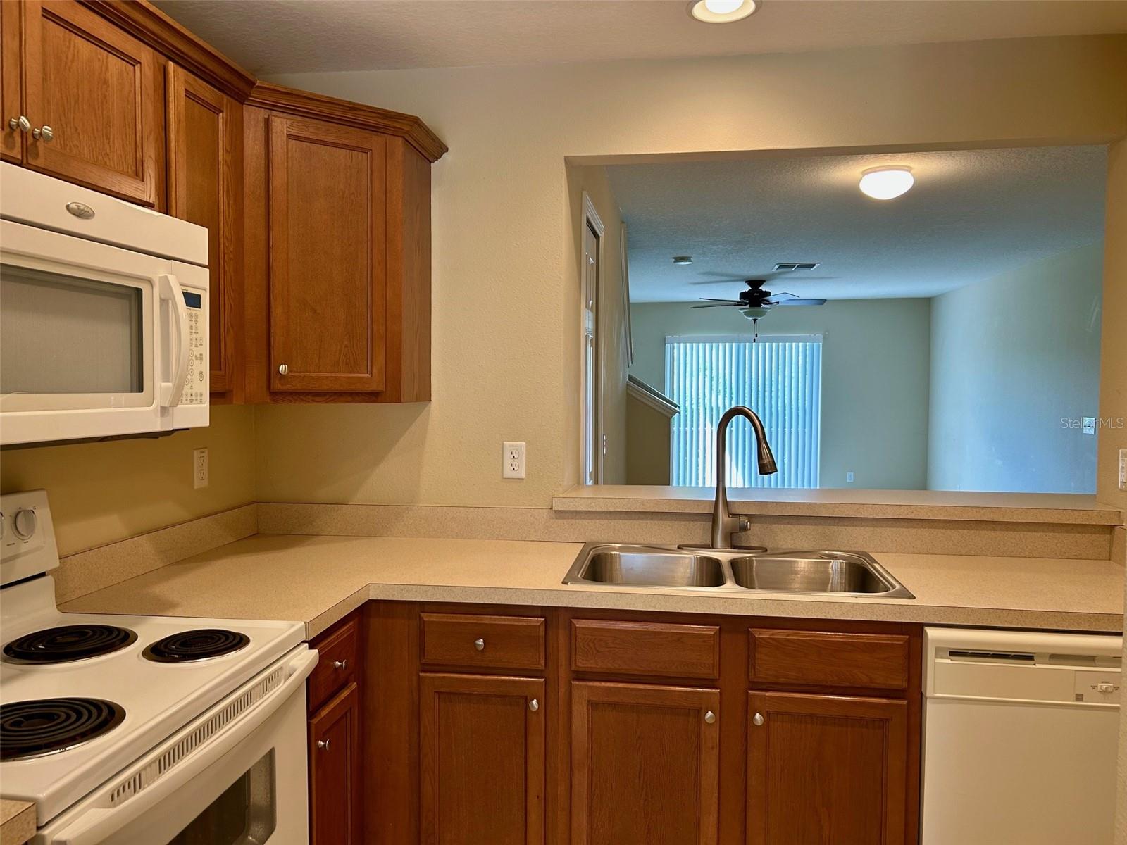 Kitchen With Pass Through To Dining Area