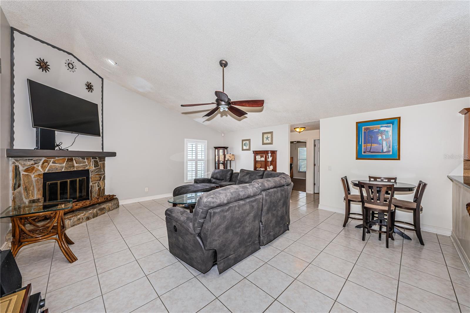 Soaring ceilings and wood burning fireplace.