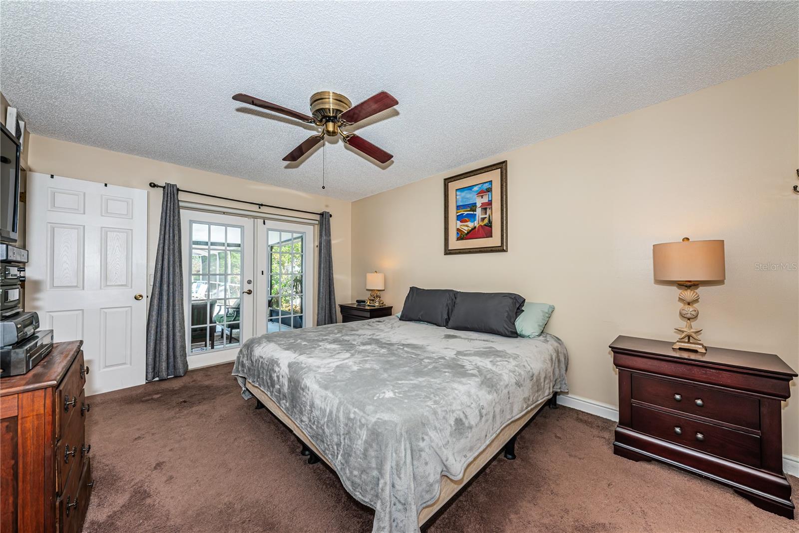 Master suite overlooks the pool and patio