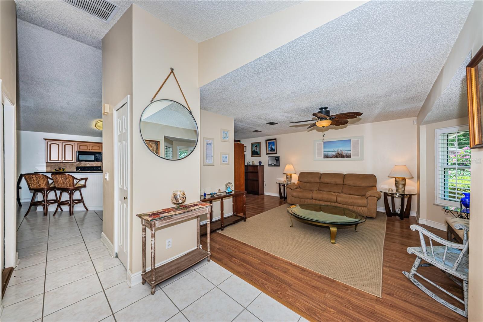 Entry foyer to living room and kitchen