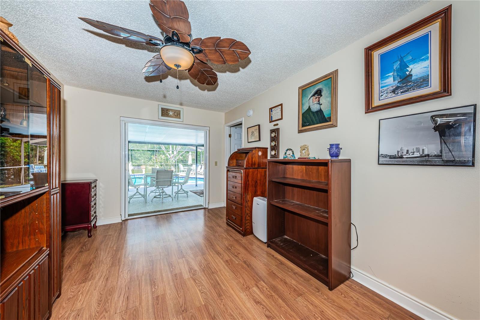 Formal dining room with French doors to pool.