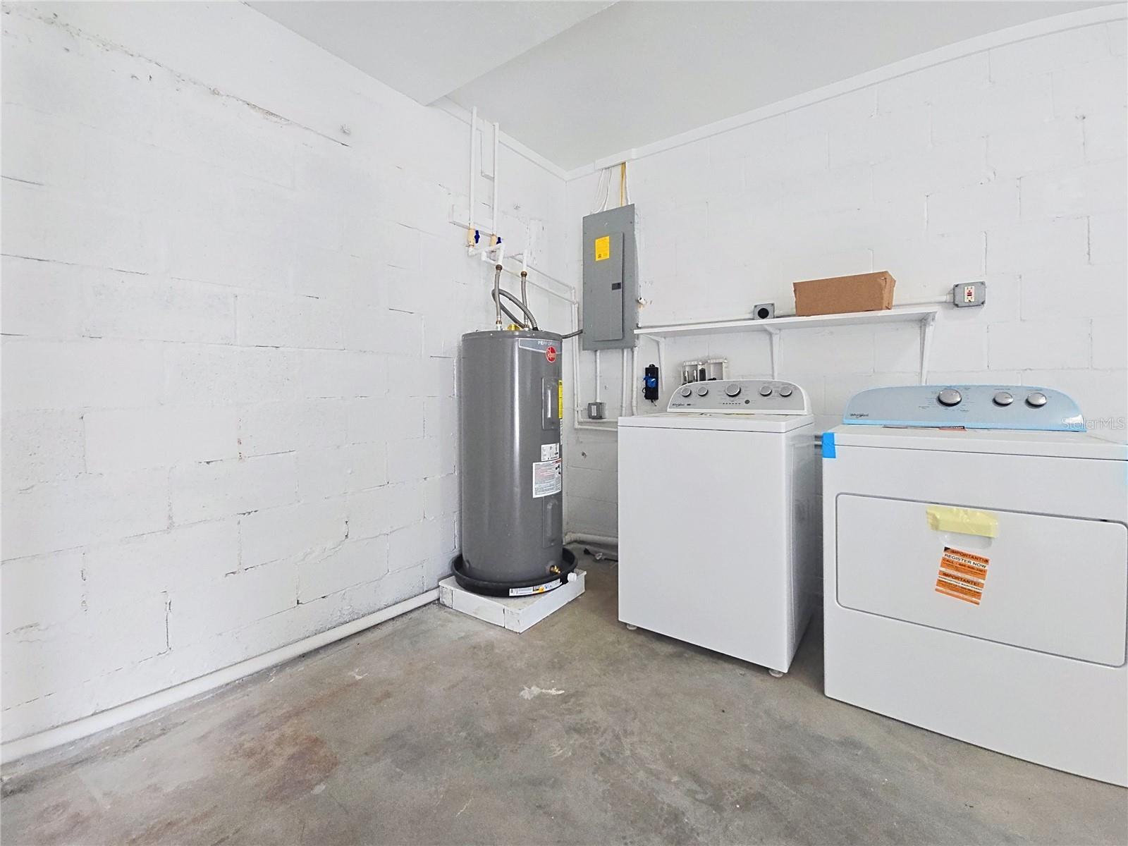 LAUNDRY AREA INSIDE GARAGE