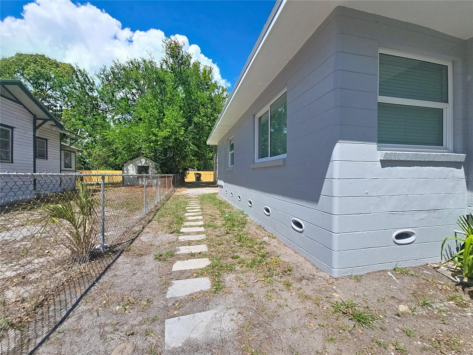 SIDE ENTRANCE TO BACKYARD