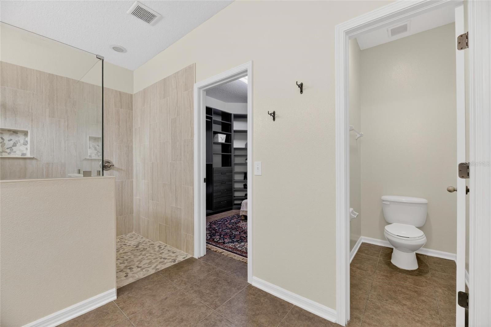 Primary Ensuite Bath with Water Closet and Walk in Closet