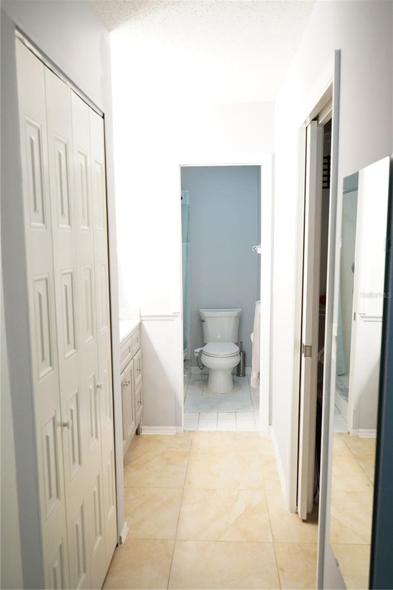hallway to closet and bath area