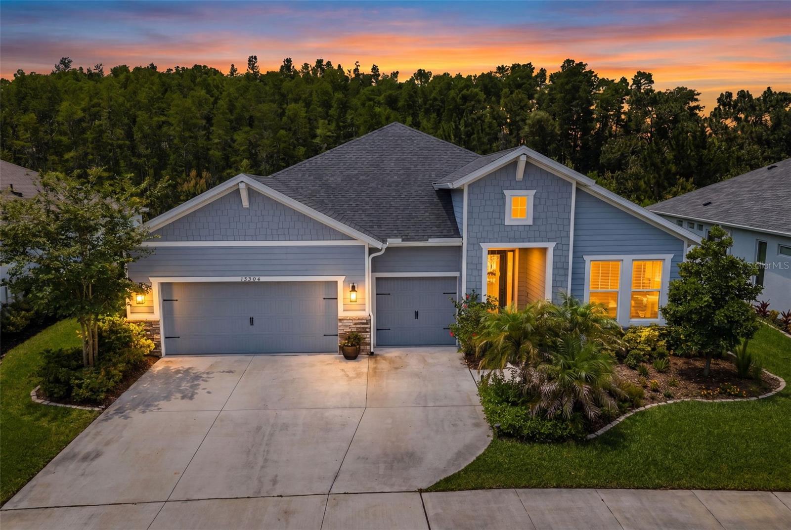 Rare single-story ICI home in Asturia’s Phase 4 with four bedrooms, three baths, a 3-car garage, and a wooded view with no rear neighbors.