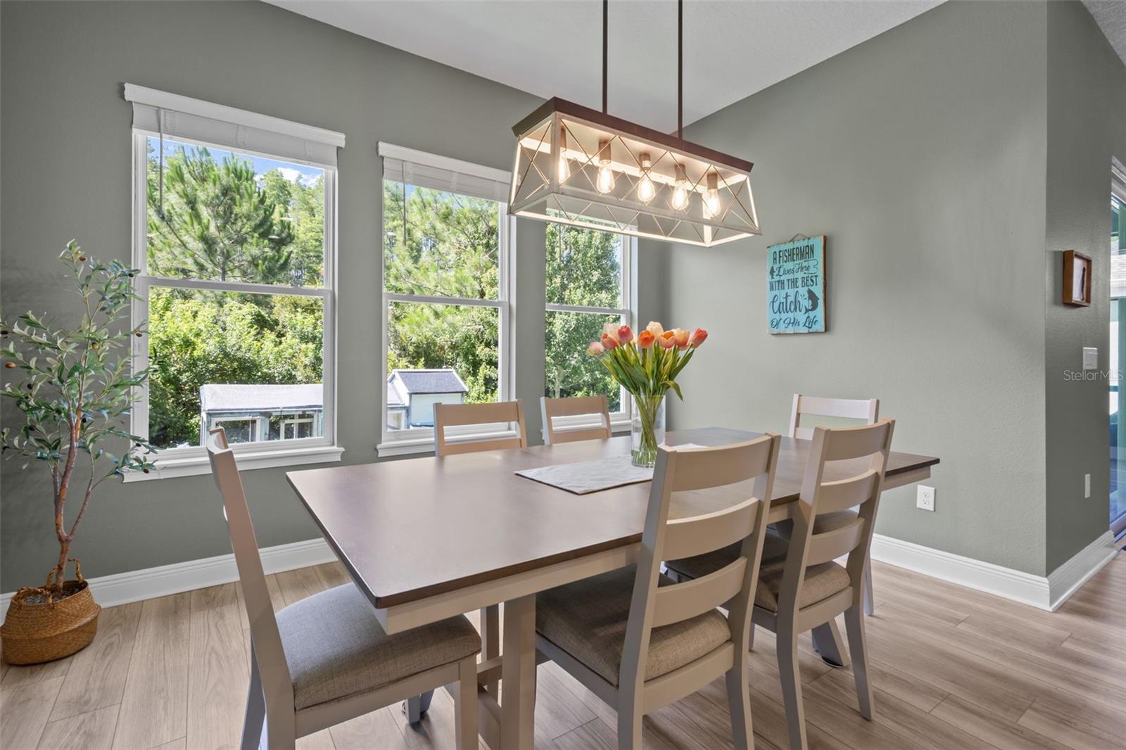 Dining area positioned just off the kitchen with views toward the backyard.