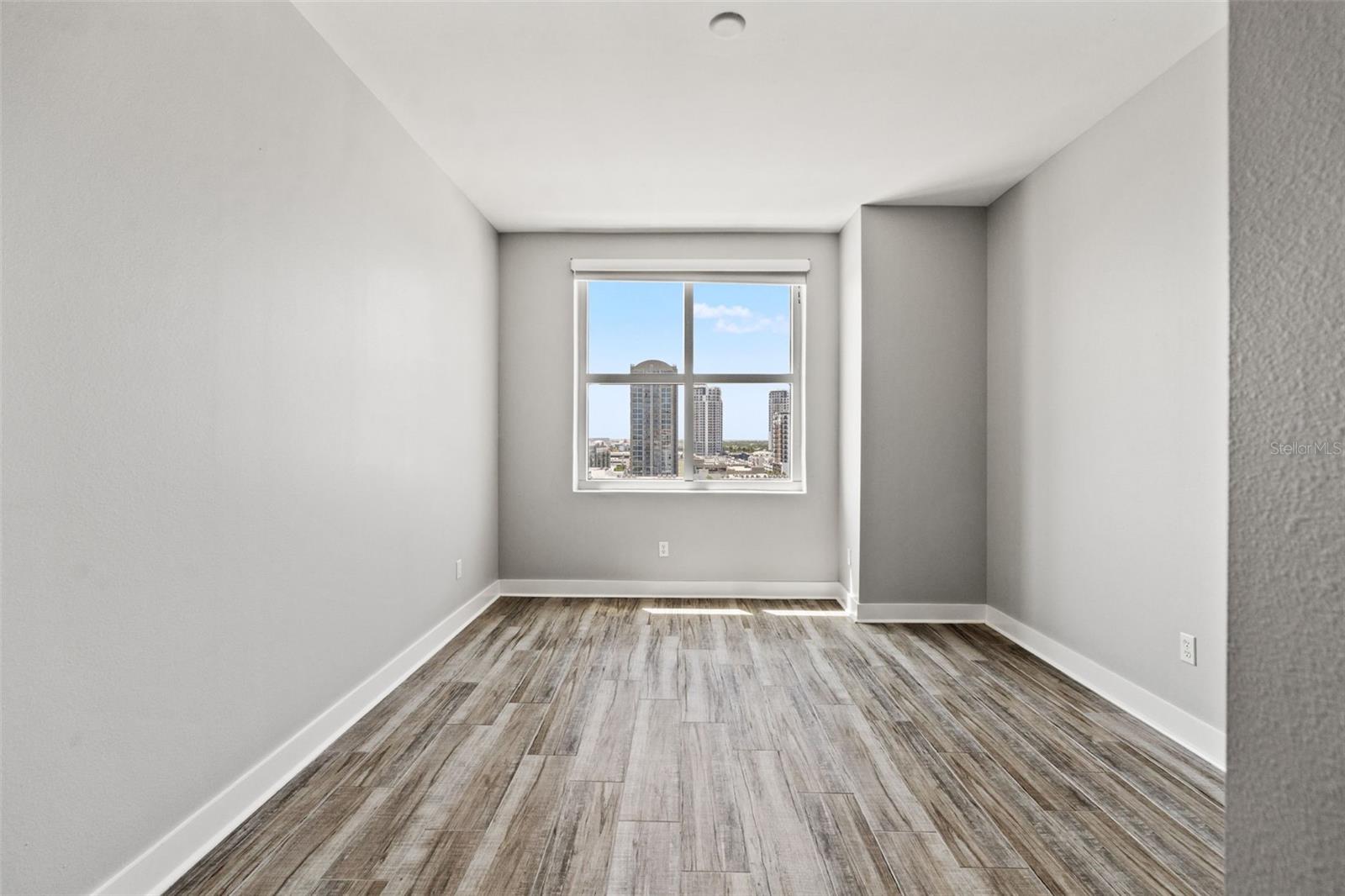Primary bedroom with ample natural light