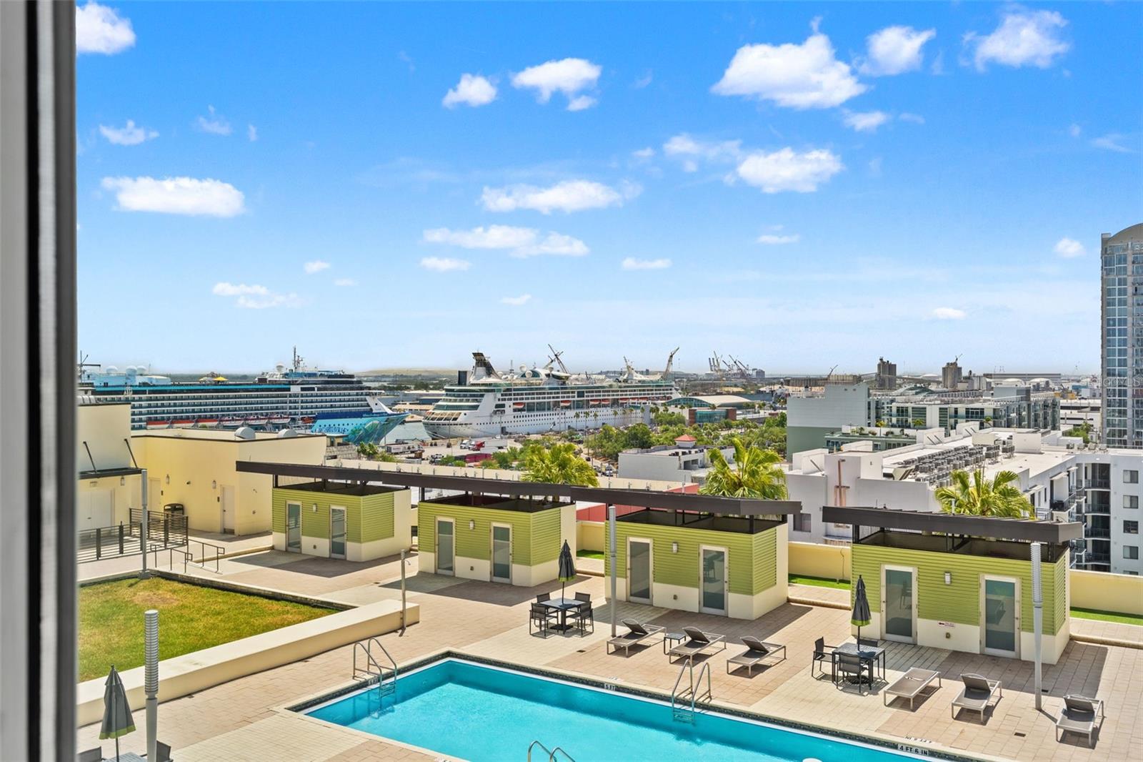 view of the pool and cabanas