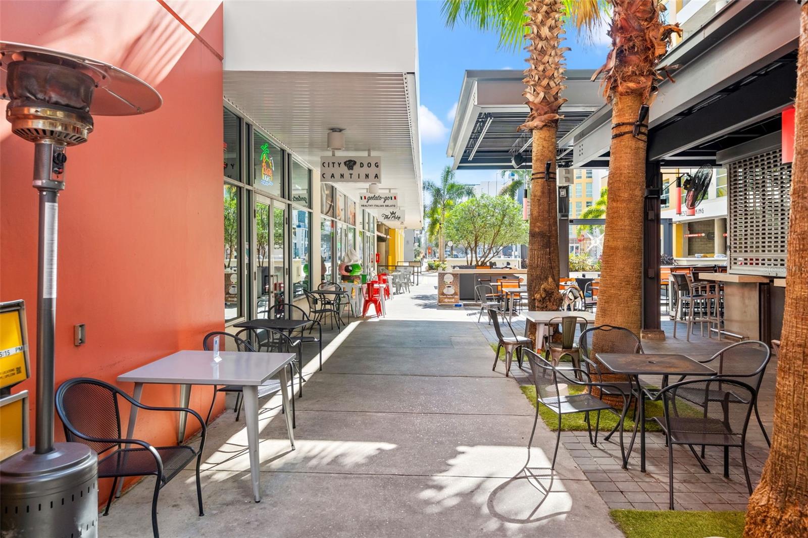 multiple restaurants in the courtyard at the base of the building