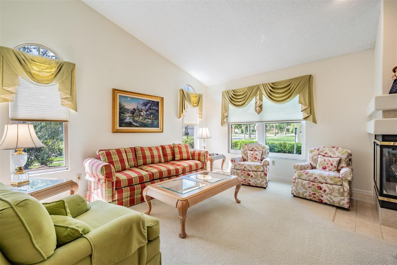 Living Room/Dining Room with Fireplace, lots of sunlight!