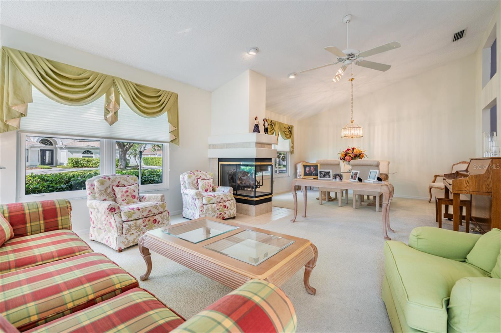 Living Room/Dining Room with Fireplace, lots of sunlight!