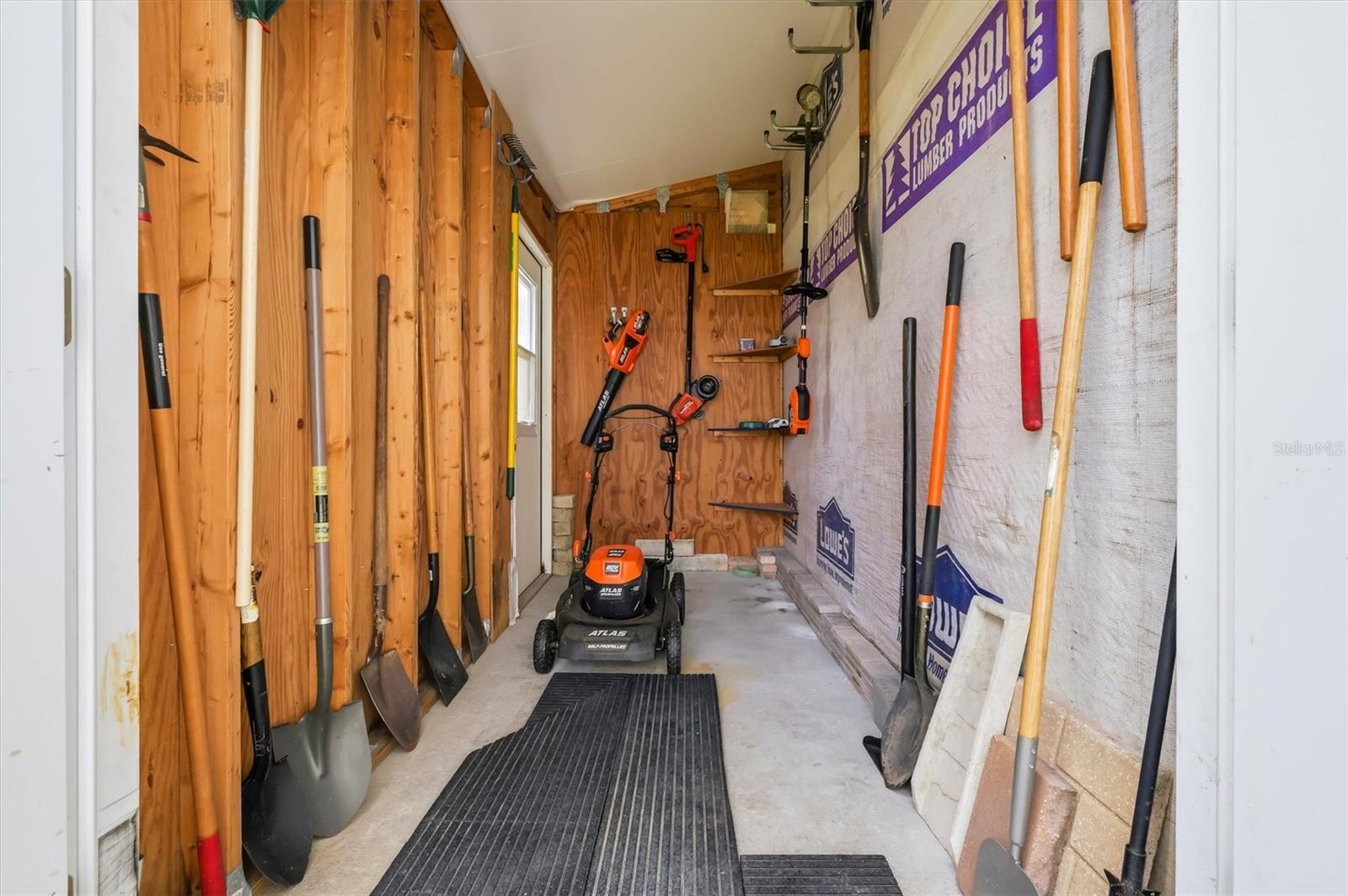 Inside of golf cart and tool shed .  Mower and tools can remain.