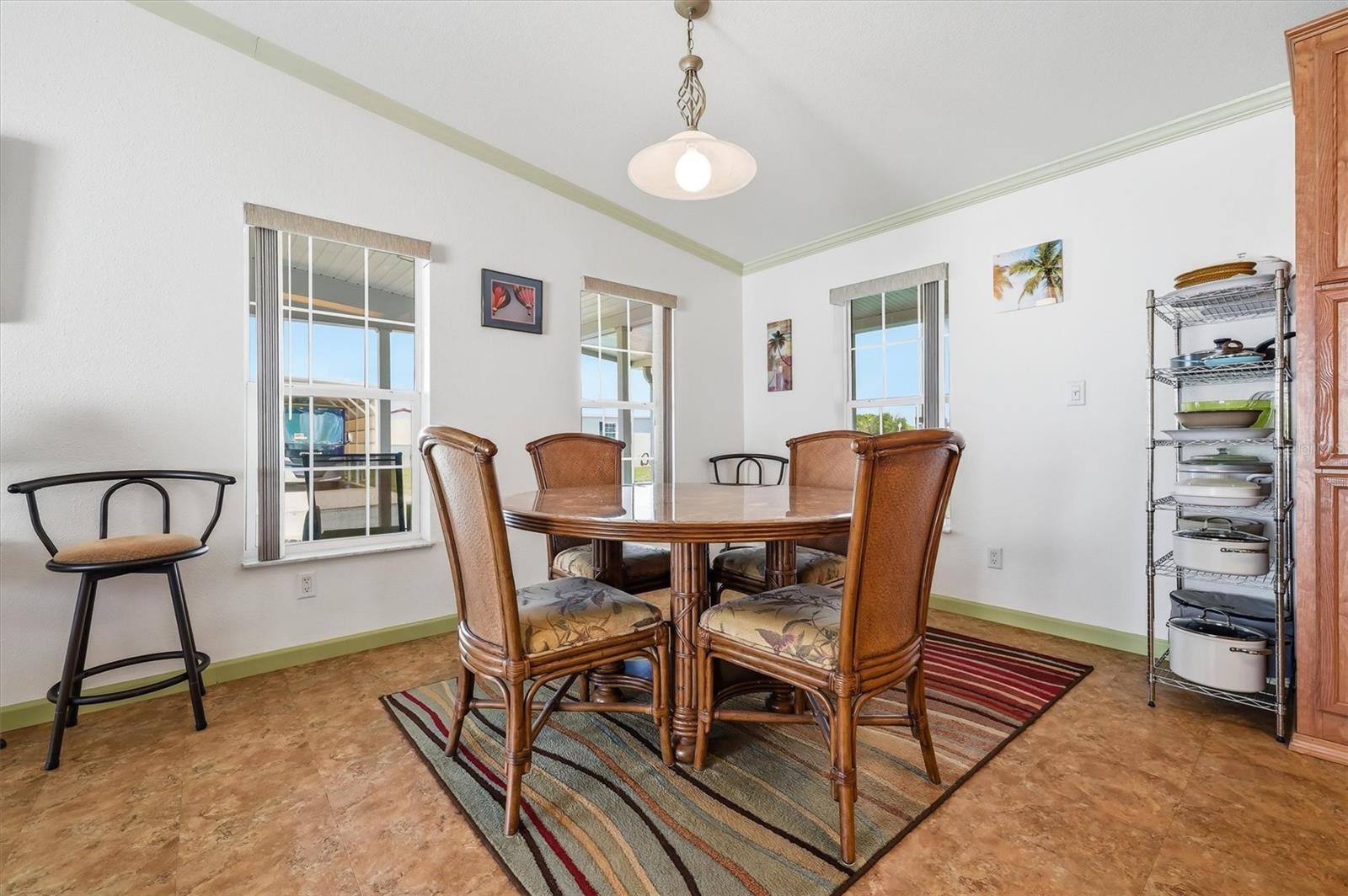 Dining area with picture window views and a lot of light