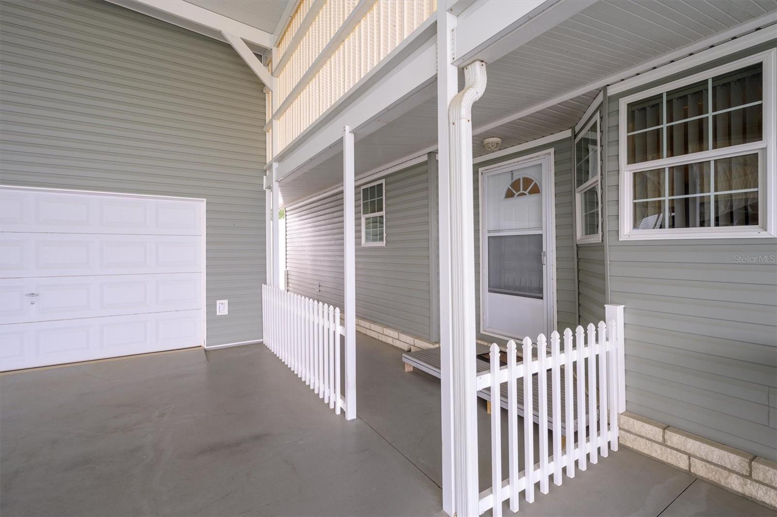 Front entrance showing separate garage entry,  which also can be used as flex room, workout room, etc.