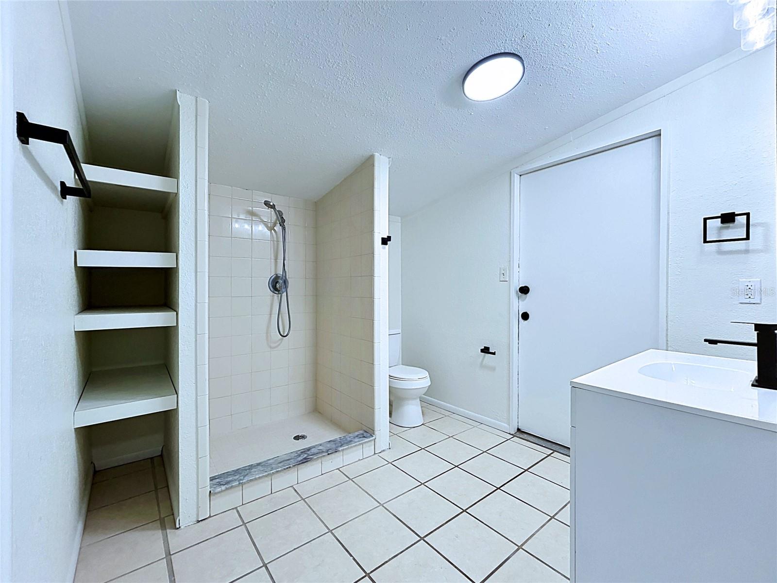 Mother in Law Suite Bathroom leading to garage/shop