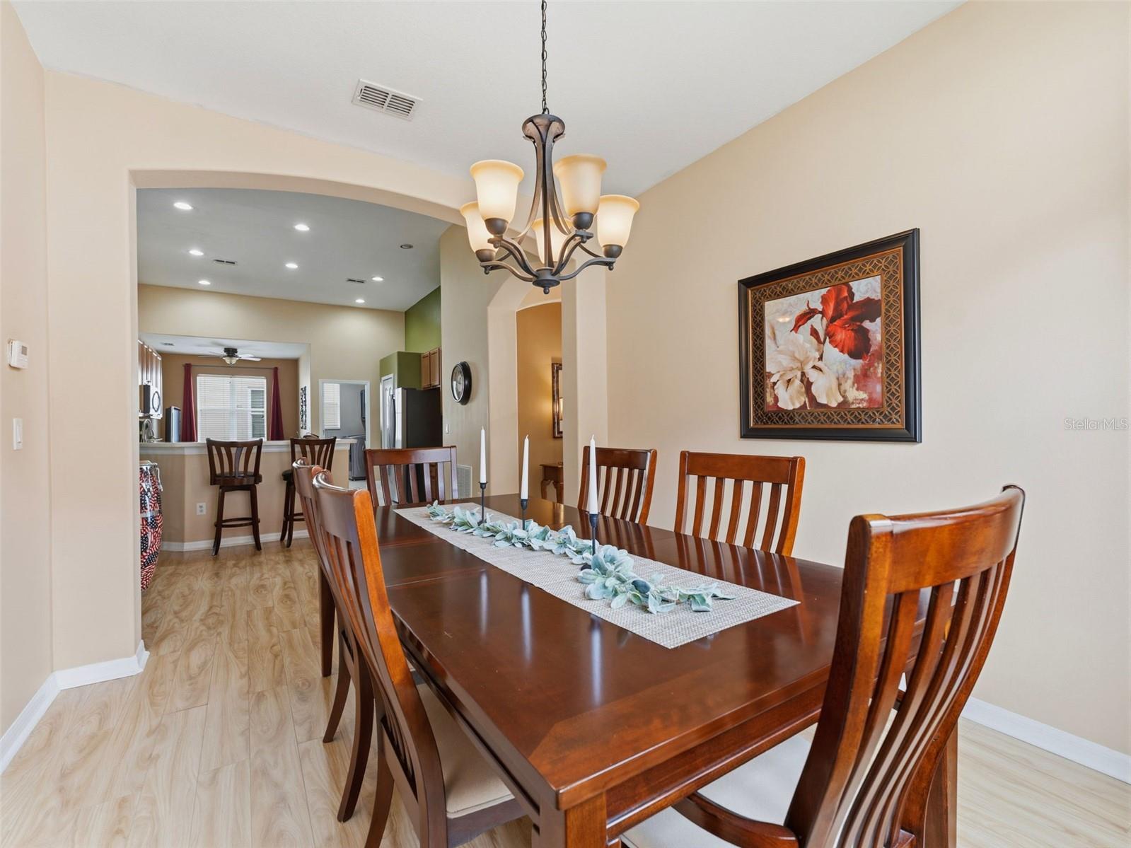 Formal dining space with tasteful lighting fixture