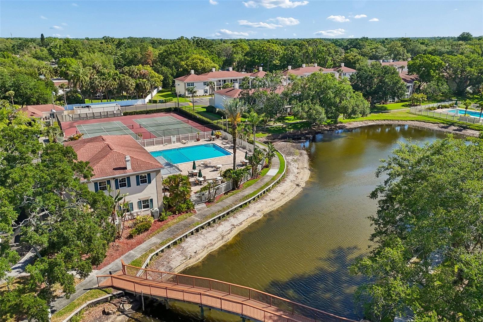 Beautiful walking paths and the club house with 2 pools, 2 tennis courts, & fitness center