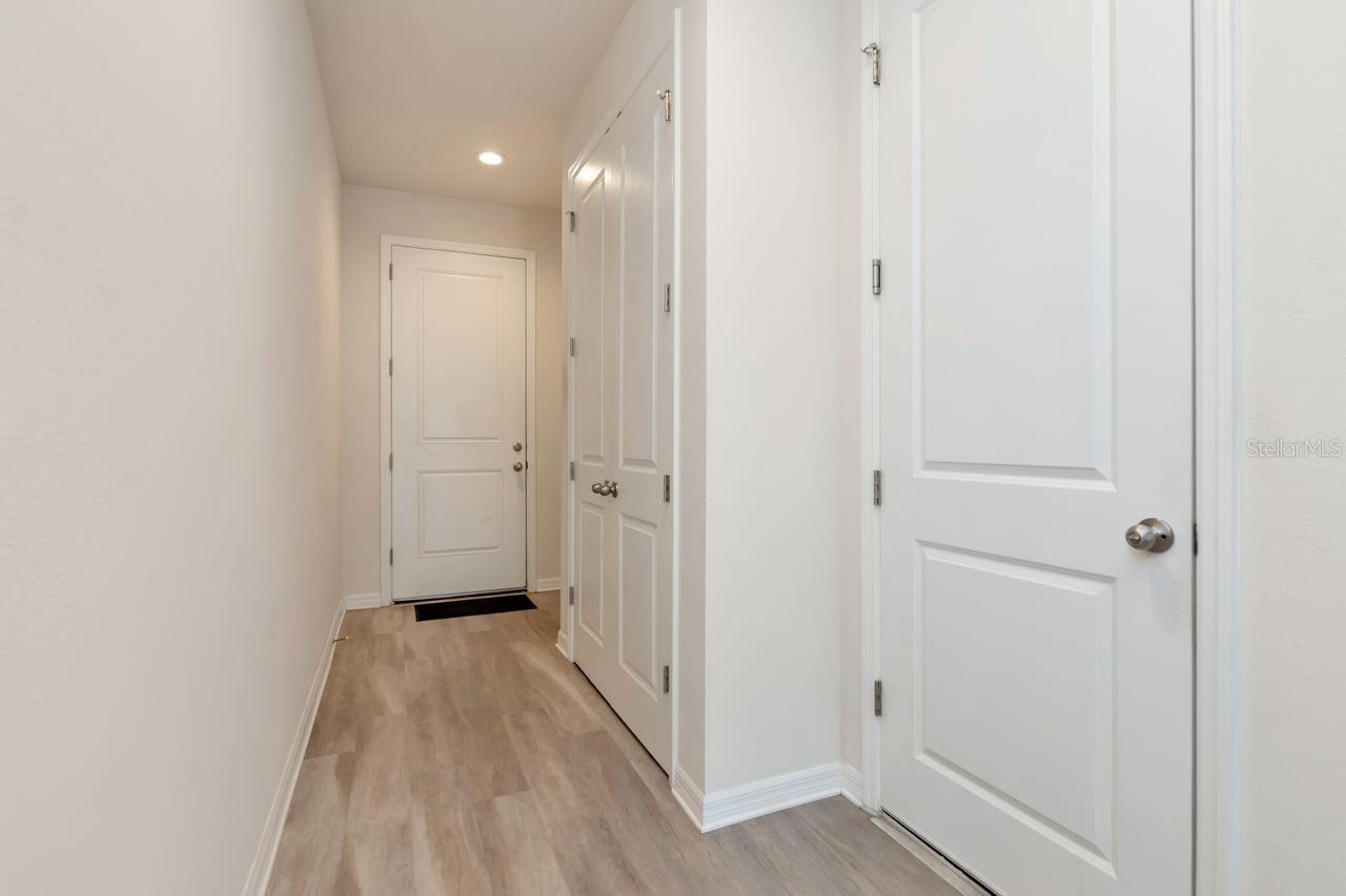 Looking back at the front door, garage door on the right