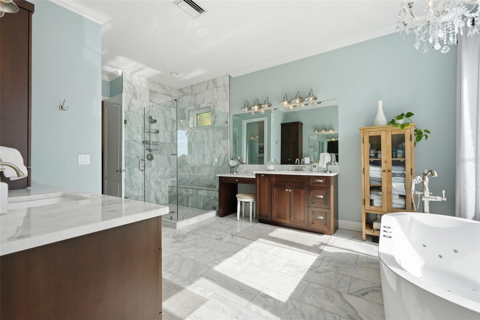 A spacious master bathroom retreat with real marble on the floors, the countertops and the shower walls. Nice, right?