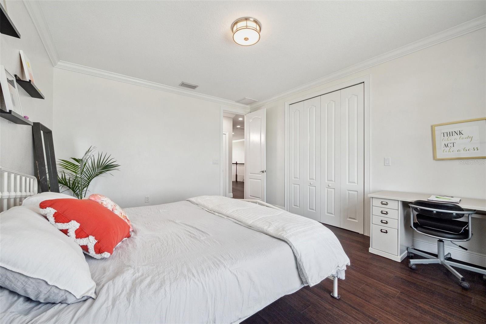 One of 3 bedrooms on the 3rd floor with backyard water view.