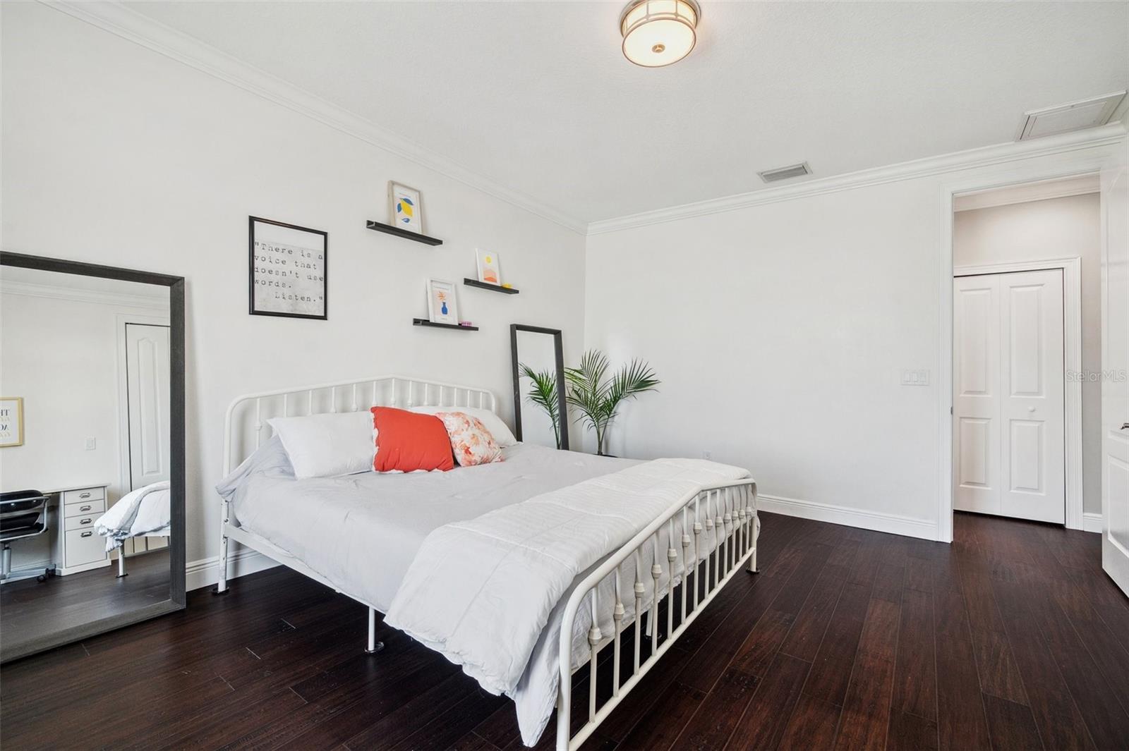 One of 3 bedrooms on the 3rd floor with backyard water view.