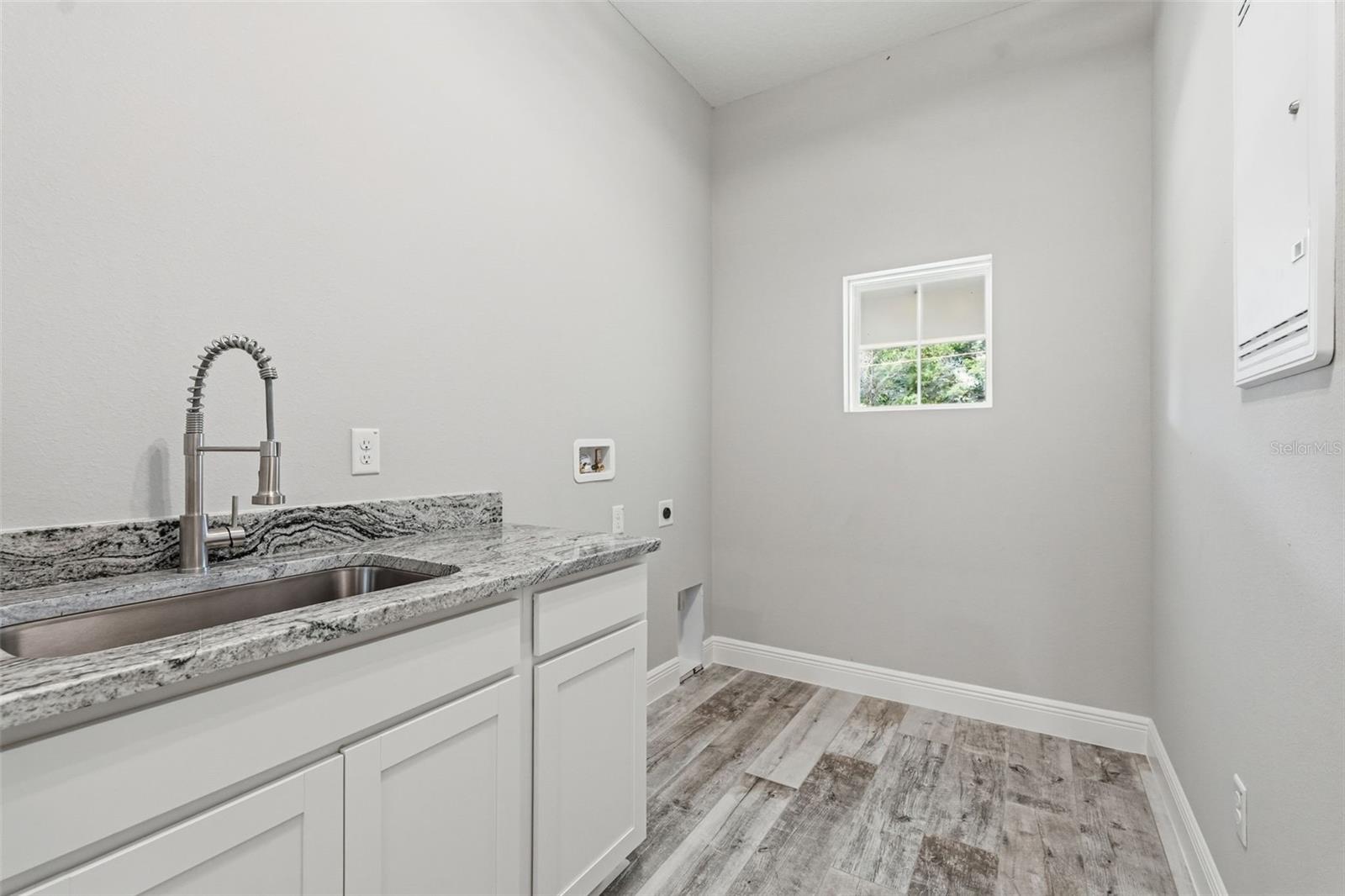 Laundry Room with granite counters
