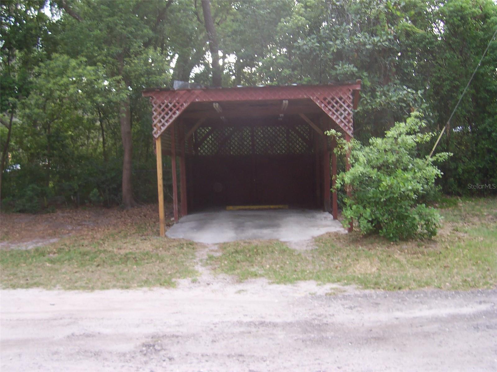One car carport but plenty of open area to park,