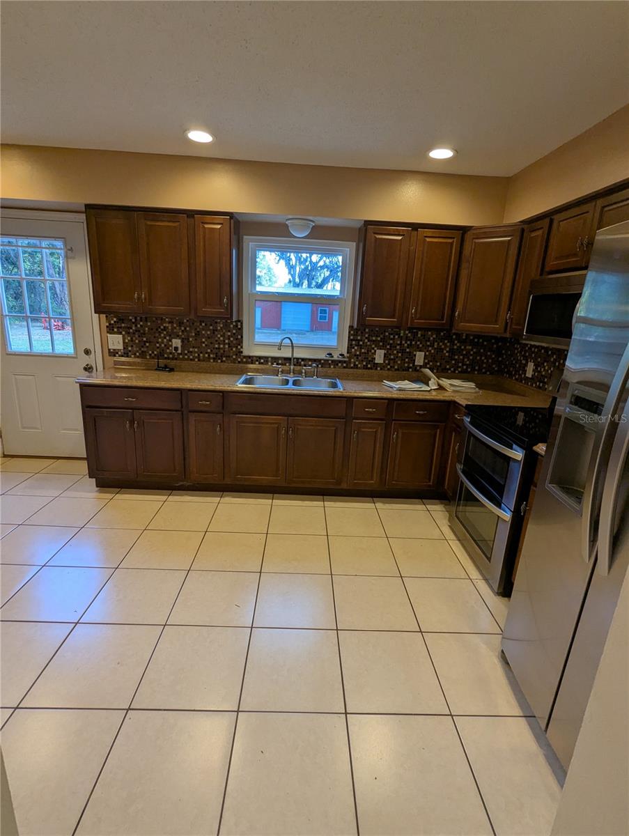 Kitchen sink area window overlooks back yard
