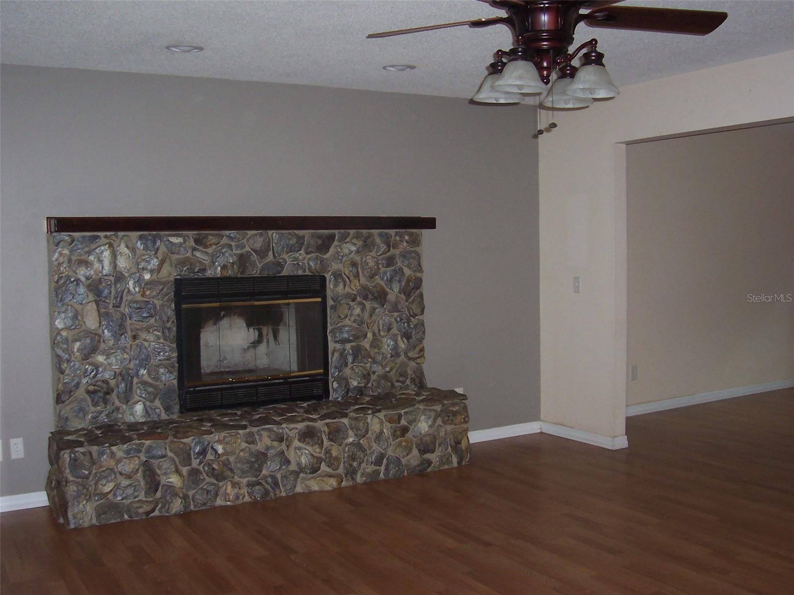 To the right of the fireplace is the entryway to the formal dining room.