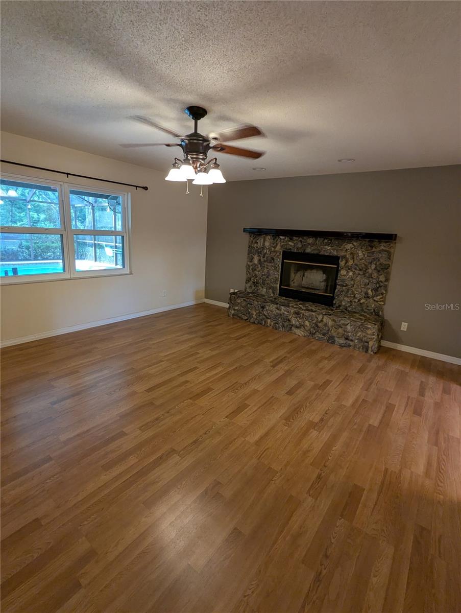 Front windows overlook pool area.