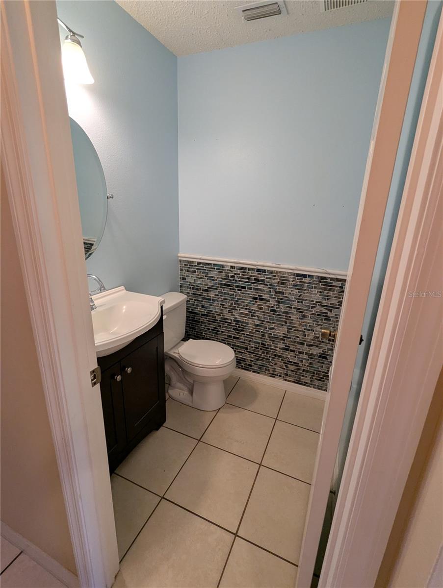 Convenient half bath downstairs.