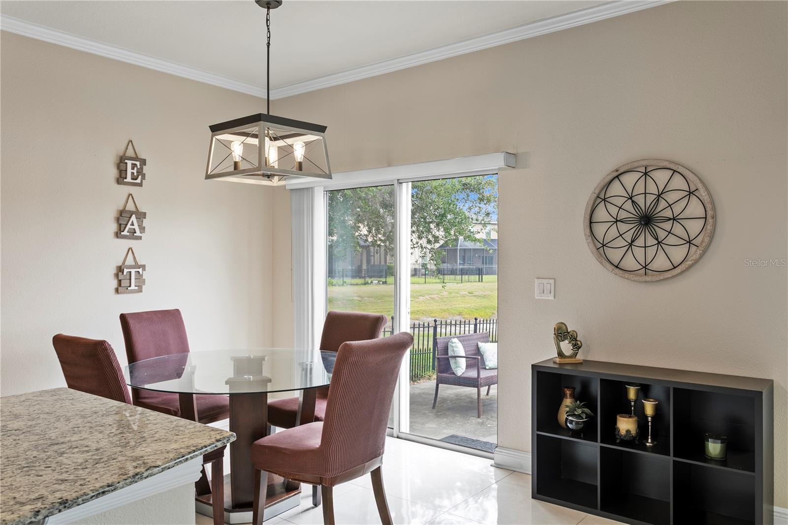 Dinette seating area with glass sliders to rear patio
