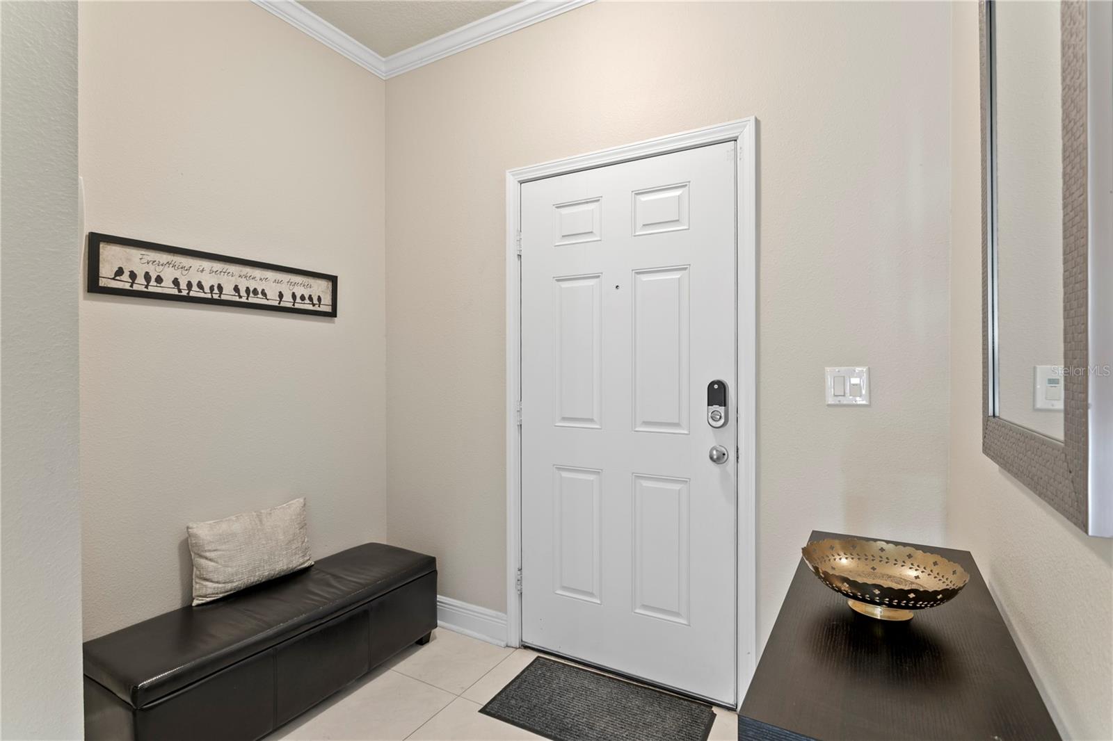 Beautiful porcelain tile greets you in the foyer