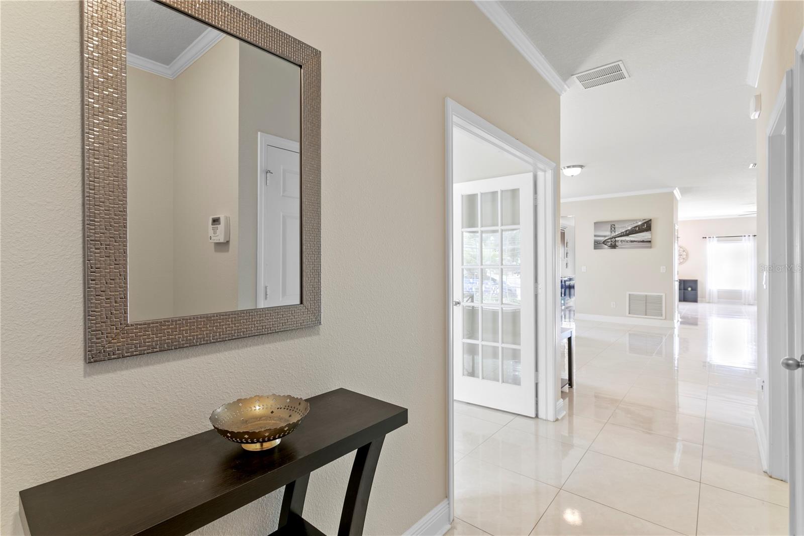Bright and airy with 9' ceilings and 24" porcelain tile throughout