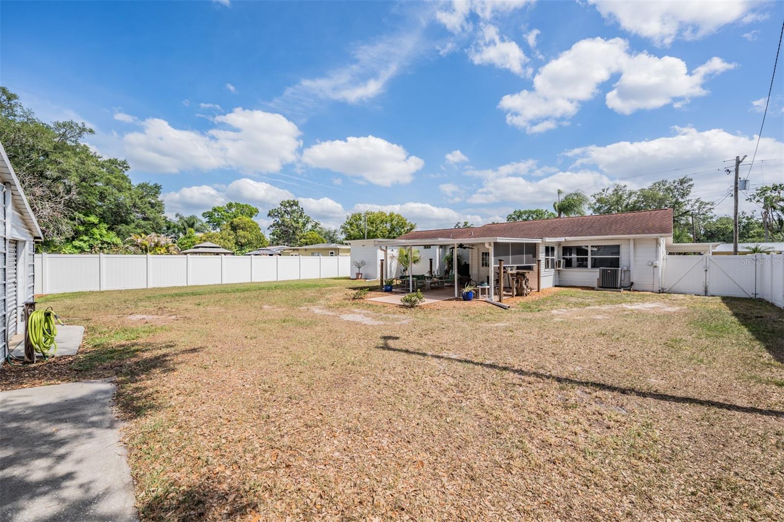 There is a double gate on one side and single gate on the other side of the house