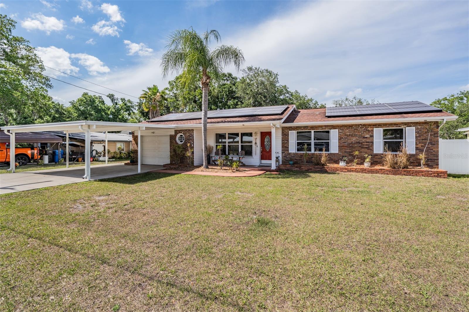 covered carport and single car garage