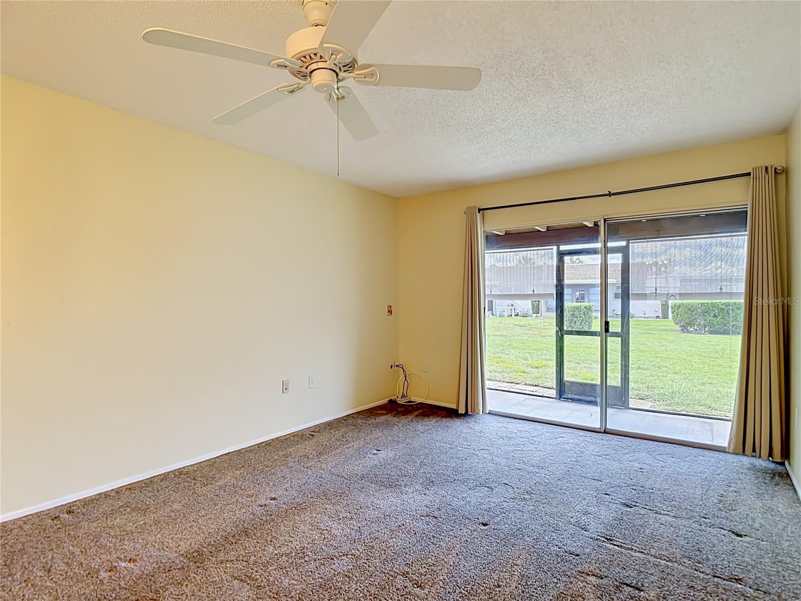 living room with ceiling fan