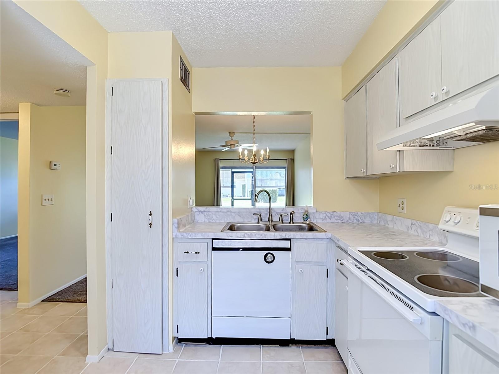 kitchen with dishwasher, range, and refrigerator