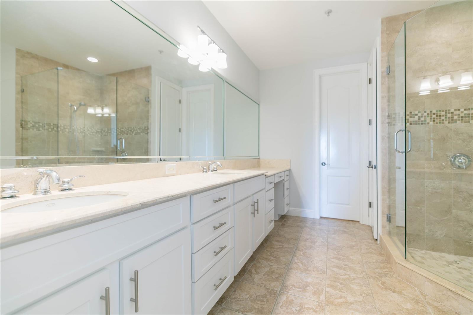 Primary ensuite is modern, large with separate water room, soaker tub, shower
