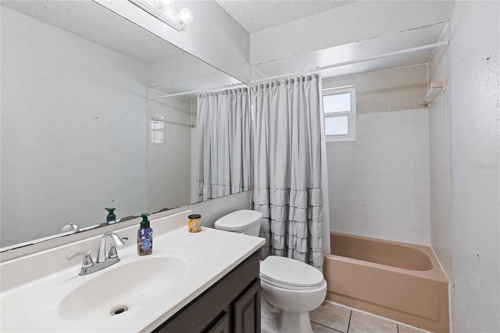 2nd bathroom with tub shower combo