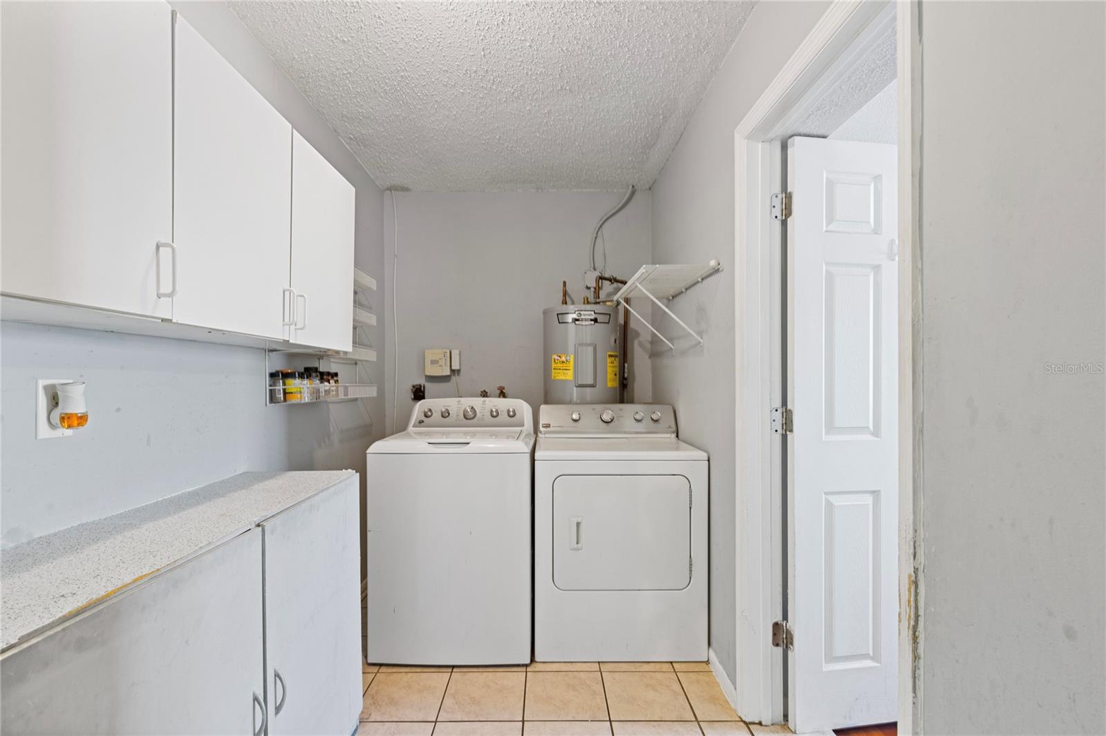 Laundry room with storage, in between bedroom 3 & 4